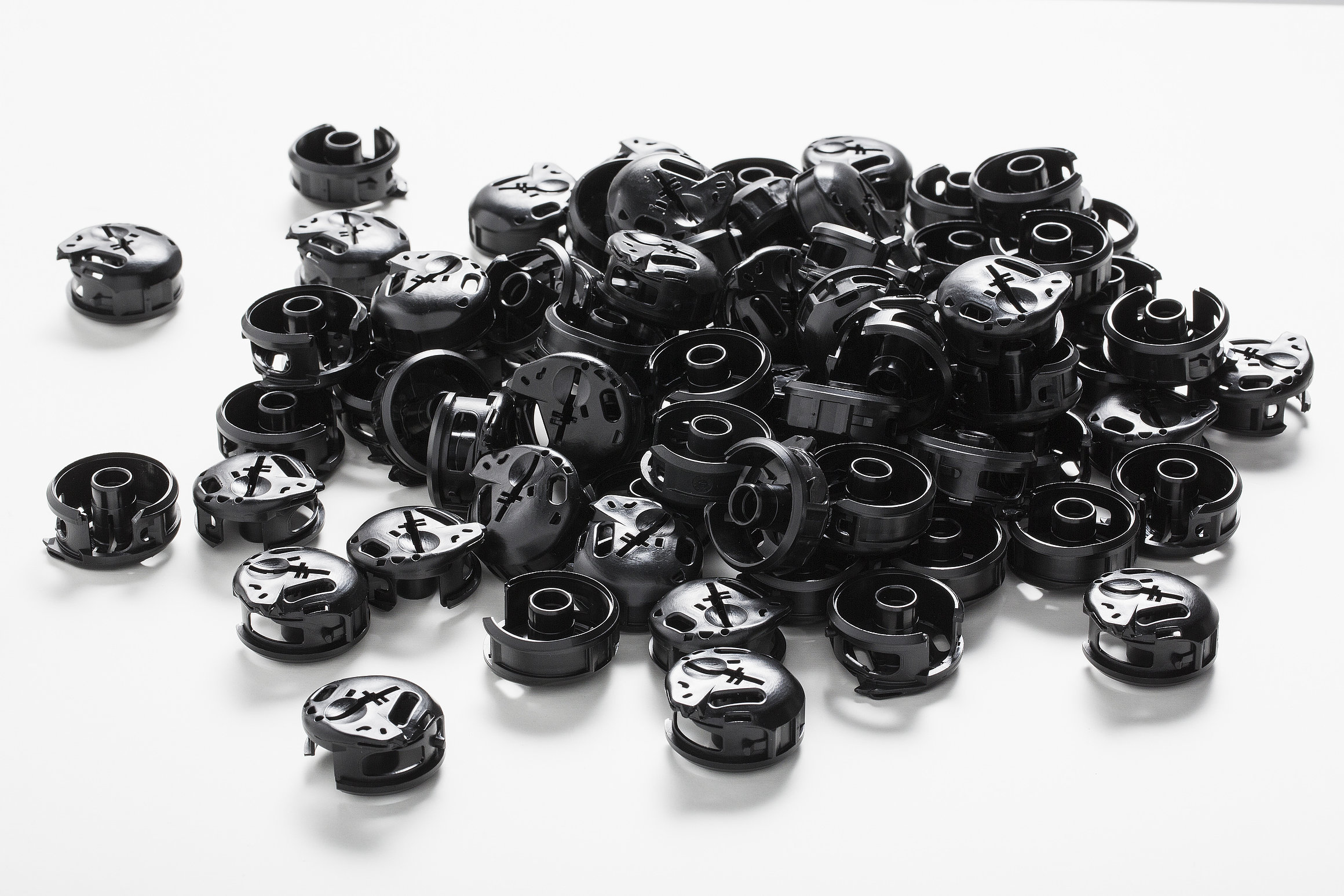 The picture shows black plastic injection molded parts