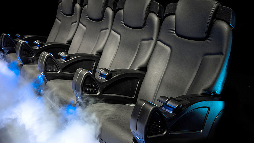 black leather cinema seats with fog coming out from below